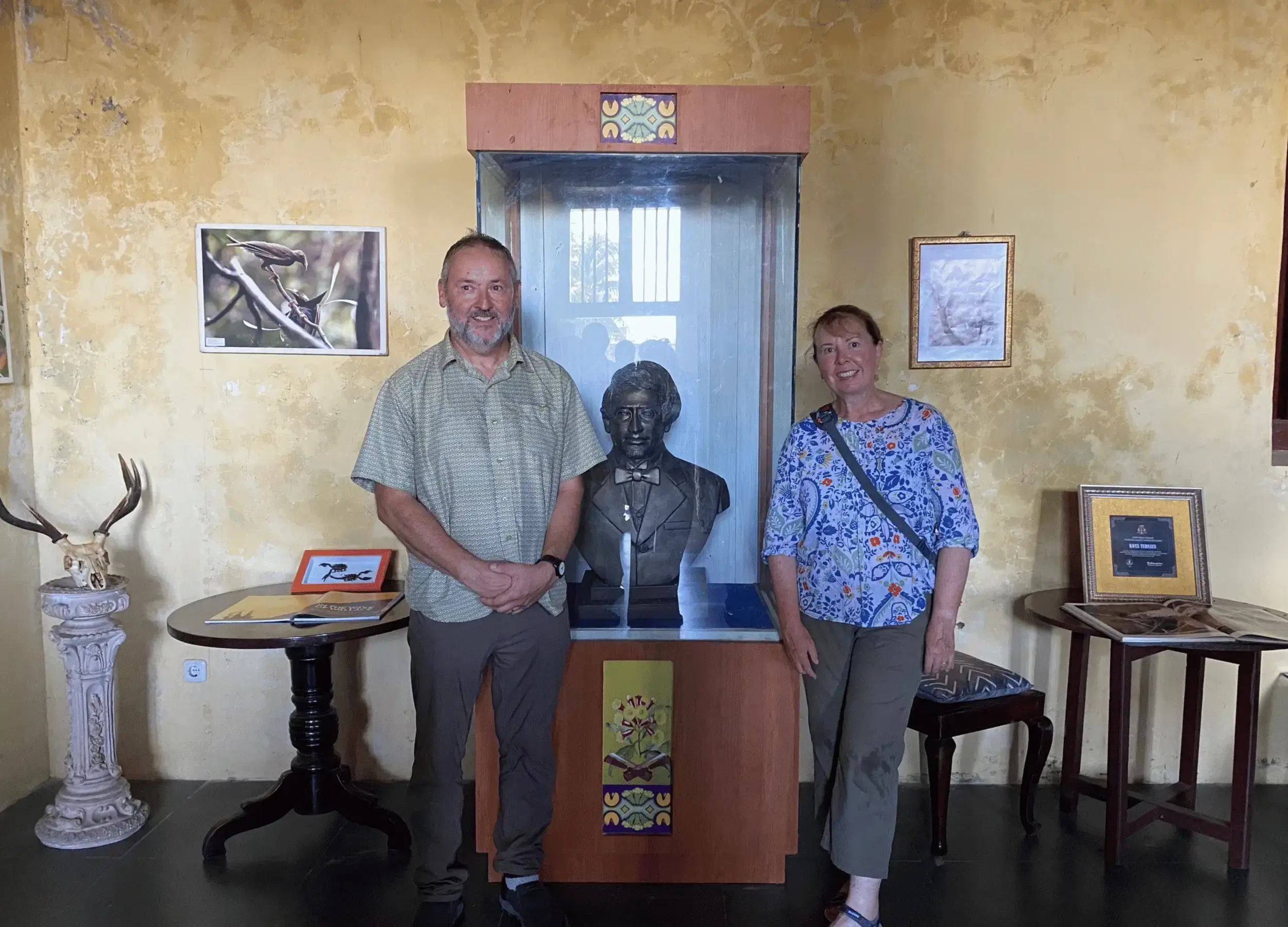 Bill Wallace and Natalie with Alfred Russel Wallace statue in the museum in Ternate
