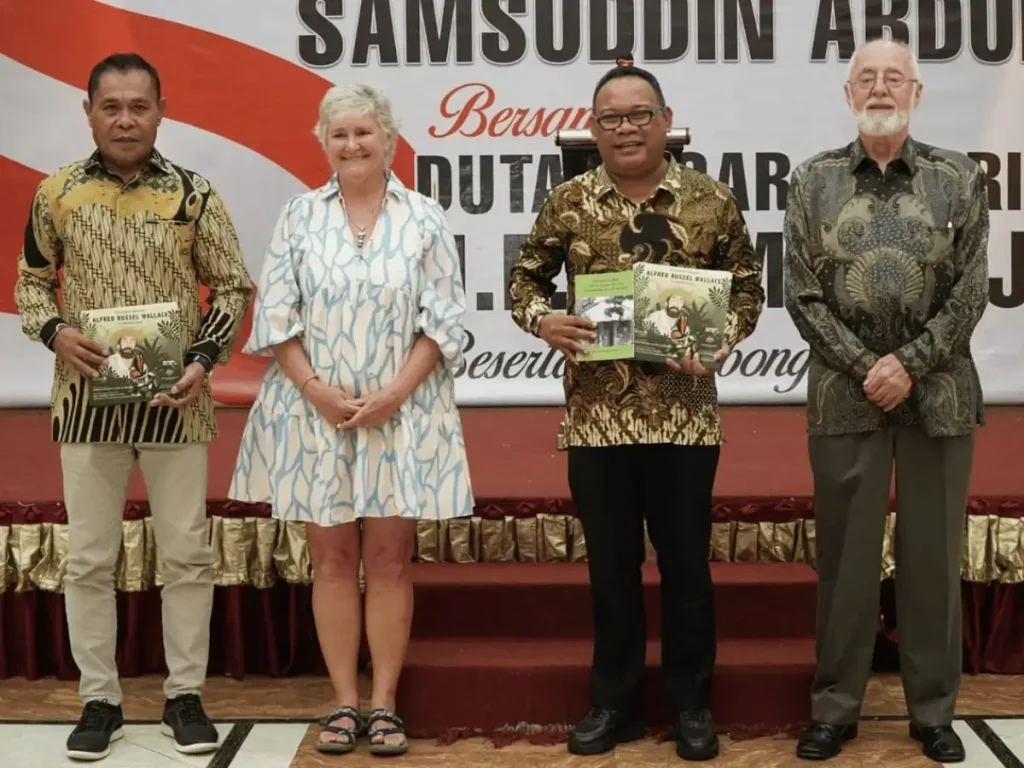 Jeni giving Wallace book to Ternate government before the Wallace plaque ceremony